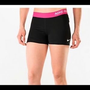 Pink and black Nike Pros